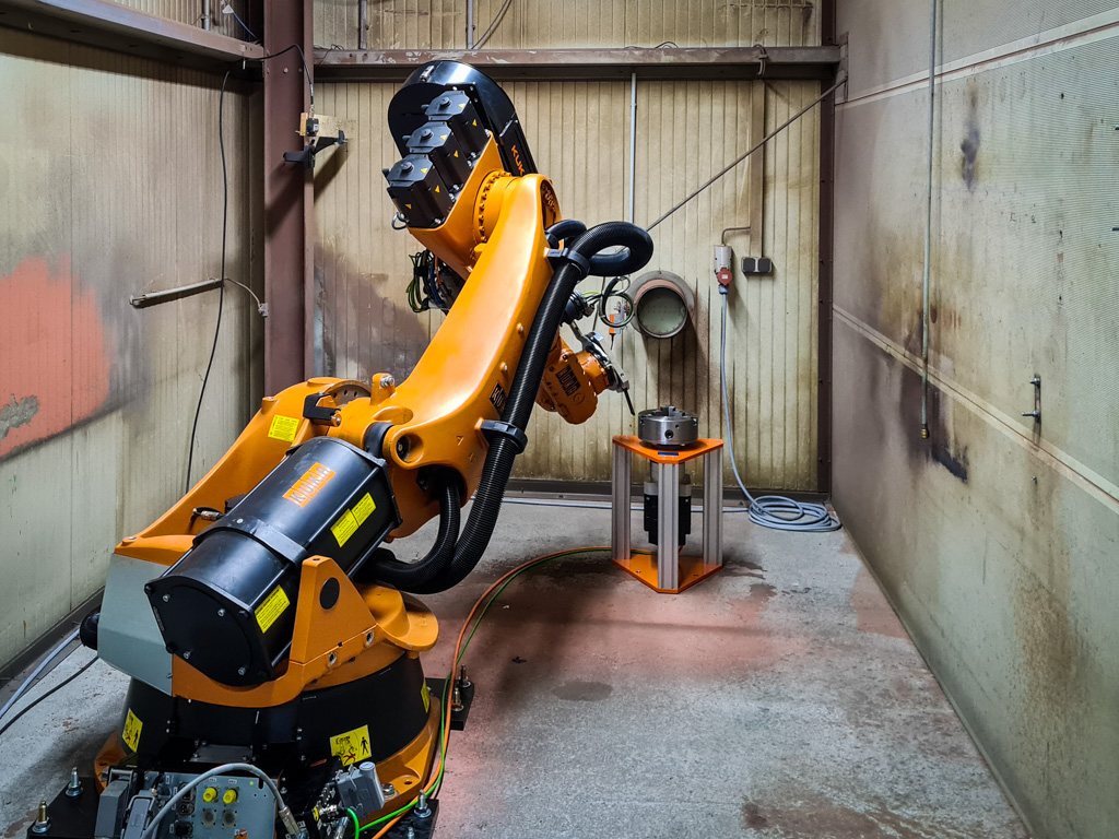 Roboterzelle zum thermischen Spritzen mit Drehpositionierer